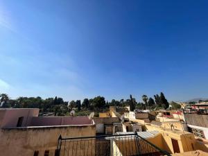 a group of buildings with a blue sky in the background at Dar Bab Boujloud Fez in Fez
