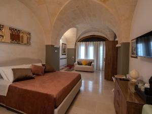 Ένα ή περισσότερα κρεβάτια σε δωμάτιο στο Residenza Kalù