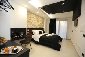 a bedroom with a bed and a table with a plate of food at B&B Il Moro Luxury Rooms in Syracuse +126 photos