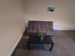 a couch in a living room with a coffee table at The Green in Sunderland