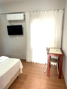 TV a/nebo společenská místnost v ubytování Xikus Palace Hotel