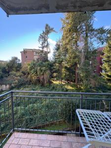 a balcony with a view of a park at Appartamento Amendola in Luino