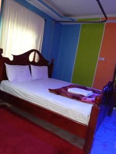 Ένα ή περισσότερα κρεβάτια σε δωμάτιο στο Villa Garbon Safaris Hotel