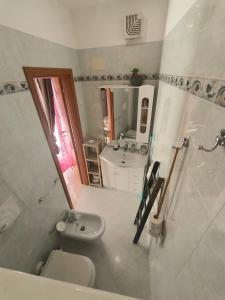 a bathroom with a sink and a toilet at By Domy 2 Grottaglie in Grottaglie +32 photos