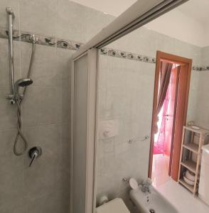 a bathroom with a shower and a toilet and a sink at By Domy 2 Grottaglie in Grottaglie