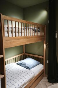 En eller flere senge i et værelse på L atelier classé 3 étoiles