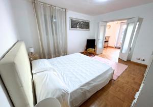 Ένα ή περισσότερα κρεβάτια σε δωμάτιο στο Dimora Porta Nuova - Sostify