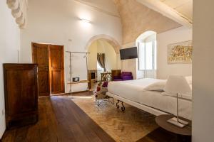 Giường trong phòng chung tại L'Artiere Dimore nei Sassi