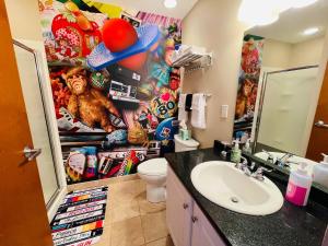 a bathroom with a toilet and a sink at Radical 80's Getaway! A Blast From The Past! in Sandusky