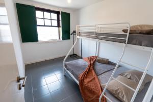 Ένα ή περισσότερα κρεβάτια σε δωμάτιο στο Renovated Historic House T2