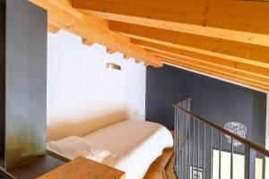 Postel nebo postele na pokoji v ubytování Ca Mantoet - The Green Loft with terrace