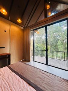 Ένα ή περισσότερα κρεβάτια σε δωμάτιο στο Liora Lodge Ella