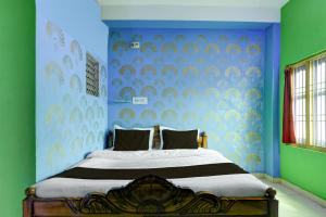 Ένα ή περισσότερα κρεβάτια σε δωμάτιο στο Hotel O Fakir Guest House