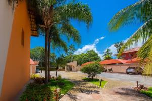 Κήπος έξω από το Duplex a 100 metros da Praia de Taperapuan