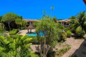 Πισίνα στο ή κοντά στο Duplex a 100 metros da Praia de Taperapuan