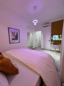 Ένα ή περισσότερα κρεβάτια σε δωμάτιο στο Swanky Spaces