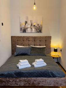 Ένα ή περισσότερα κρεβάτια σε δωμάτιο στο Urban Loft Studio 33