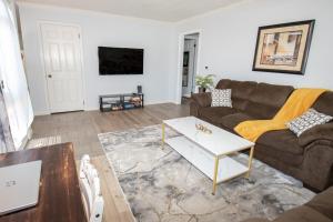 a living room with a couch and a coffee table at Charming Lafayette Condo Cozy Retreat in Indiana in Lafayette