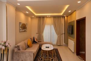 a living room with a couch and a table at Rashha Suites Jhika Gali Murree in Murree