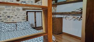 a room with two bunk beds and a desk at Haraneko Errota Burdindegi in El Cerco