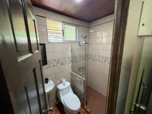 a bathroom with a toilet and a sink at Serene Oasis Hideaway in Fortuna +8 photos