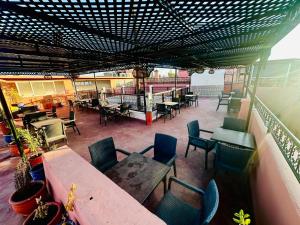 a view of a patio with tables and chairs at Riad hotel Cecil in Marrakesh