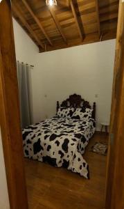 Giường trong phòng chung tại Chale Quinta Real