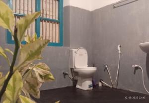 a bathroom with a white toilet in a room at Grandma's House Villa in Weligama +14 photos