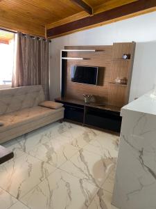 Телевизор и/или развлекательный центр в Kitnet Centro da Cidade