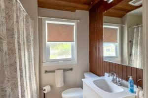 a bathroom with a sink and a toilet and a window at Clara's Retreat: Rocky Nook Kingston in Kingston +42 photos