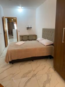 Кровать или кровати в номере Kitnet Centro da Cidade