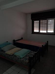 Postel nebo postele na pokoji v ubytování Cosquin centro con 2 cocheras