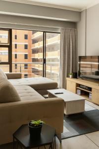 Et opholdsområde på Luxury Modern Apartment