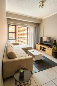 Et opholdsområde på Luxury Modern Apartment