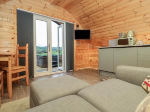 a living room with a couch and a table at Rowan in Ulverston