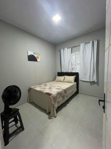 Ένα ή περισσότερα κρεβάτια σε δωμάτιο στο AP Quatro Estações