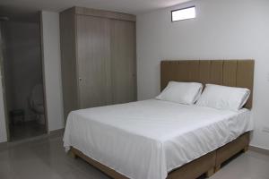 Ένα ή περισσότερα κρεβάτια σε δωμάτιο στο Hotel Ces