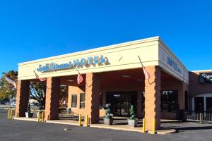 a building with a sign on the front of it at Suite Dreams Motel By Capital O Mattoon I - 57 in Mattoon