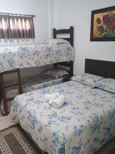 Кровать или кровати в номере Kitnet no interior de São Paulo 25