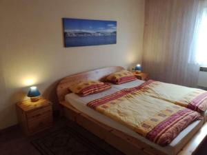 Ένα ή περισσότερα κρεβάτια σε δωμάτιο στο Ferienhaus im Ferienpark Mirow