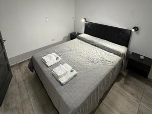 Ένα ή περισσότερα κρεβάτια σε δωμάτιο στο Apart's Sobremonte - Deptos Modernos