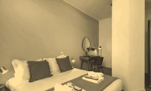 Ένα ή περισσότερα κρεβάτια σε δωμάτιο στο 2 izvrsne sobe +2 φωτογραφίες