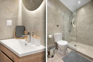 a bathroom with a sink and a shower and a toilet at Estia Premium Apartments - Superior Suite Vackhou 1 in Thessaloniki