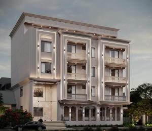 a white building with a car parked in front of it at The Regal Crown By Ritya Hotels in Ayodhya