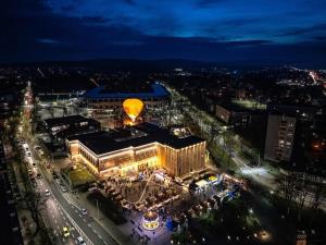 an aerial view of a city at night at Hotels Widok Rynek Centrum-fvat in Kielce