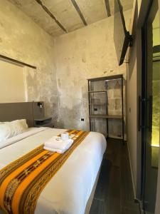 Postel nebo postele na pokoji v ubytování Inti Paqari