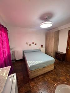 Ένα ή περισσότερα κρεβάτια σε δωμάτιο στο Apartamento 1