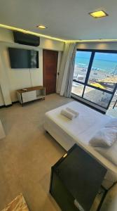 TV a/nebo společenská místnost v ubytování Mirassol Flats