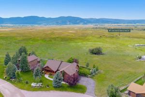 an overhead view of a house with a field and a barn at Upscale Hot Tub Wildlife Views in Victor