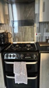 a kitchen with a stove with a towel on it at 28 Russell road in Bristol
